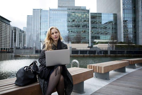 Woman Working Outdoors Using Laptop